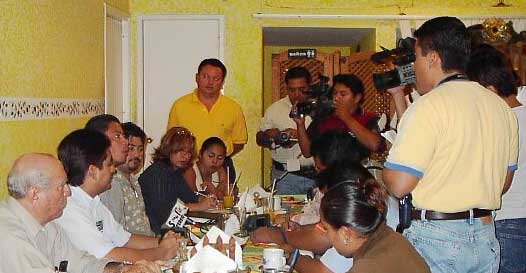 Dr. Victor Zavala (seated third from left) shares observations from the assessment conducted in January 2004 with Presidente Carlos Hernandez Blanco (seated second from left) and the press.