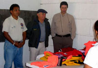 From left: Daniel Alvarez Villanueva, Director Civil Protection; Jorge Martin Angulo, General Secretary; and Gustavo Maldonado Saldana, 8th Precinct Councilman, receive rescue equipment on behalf of the Water Rescue Committee of Cozumel. Maldonado expressed, 