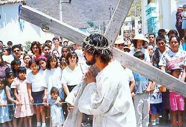A Local Portraying Jesus Christ Bearing the Cross to His Crucifixion!